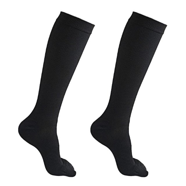 Compression stockings for women and men, shown in black, made of stretchable nylon material. These knee-high socks provide non-binding compression to improve circulation, reduce swelling, and relieve tired, aching legs. Designed with a smooth seamless toe, they are lightweight, breathable, and moisture-wicking to maintain optimal temperature and joint stability. The socks stay in place without sliding down and retain their shape after multiple washes. Available in sizes S/M and L/XL.