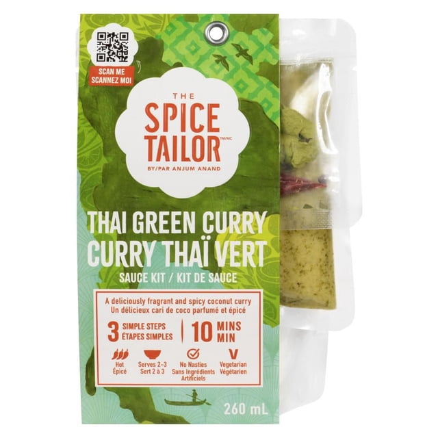 The Spice Tailor Thai Green Curry sauce kit in green packaging with white and orange text, showing a 260 mL label, a QR code, and a clear pouch containing green curry paste and dried red chili, highlighting its spicy, vegetarian, and no artificial ingredients features.