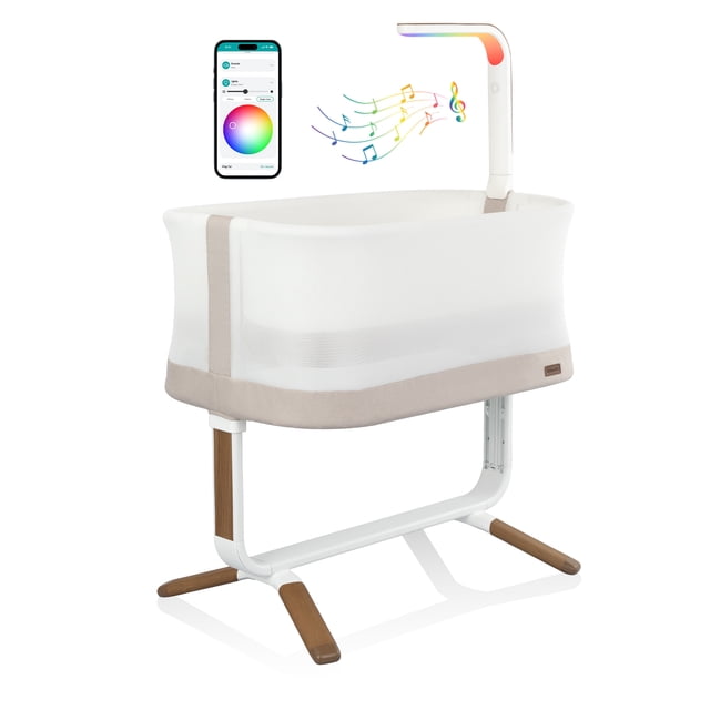 Evenflo Cora 3-Level Adjustable Bassinet (Coastal Coffee) front-facing portable bassinet with wood-like frame and breathable air mesh sides, integrated SensorySoothe technology bar with lights, music and speaker, app-controlled features and three mattress drop positions for use up to one year.