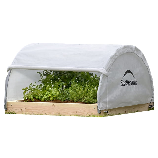 ShelterLogic Grow IT 4 x 4 x 2 ft translucent backyard raised bed round greenhouse with a wooden base and triple-layer ripstop translucent cover featuring a roll-up front panel for airflow and temperature control, suitable for seed starting and extending the growing season.