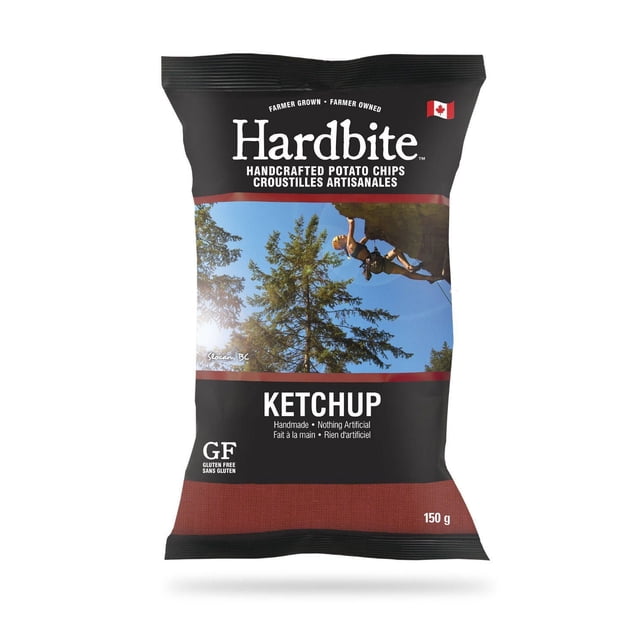 Hardbite Chips Hardbite Ketchup Handcrafted Potato Chips 150 g bag with black and dark red packaging featuring a rock climber on a cliff with trees and blue sky, gluten free and handmade with no artificial ingredients, Canadian flag displayed.