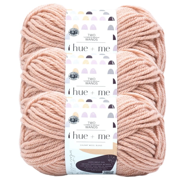 Lion Brand Hue + Me Yarn in a soft peach color, featuring three bulky weight skeins stacked with Two of Wands labels, made from a chunky wool blend suitable for knitting, crocheting, and machine washable projects.