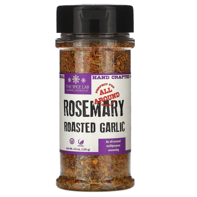 The Spice Lab Rosemary Roasted Garlic seasoning in a 4.9 oz (138 g) jar. The clear container showcases the blend of herbs and spices, with a black twist-off lid. The label highlights features such as 'Hand Crafted,' 'Perfect for All Around Grilling,' and 'Kosher.' Suitable for multipurpose seasoning and grilling.
