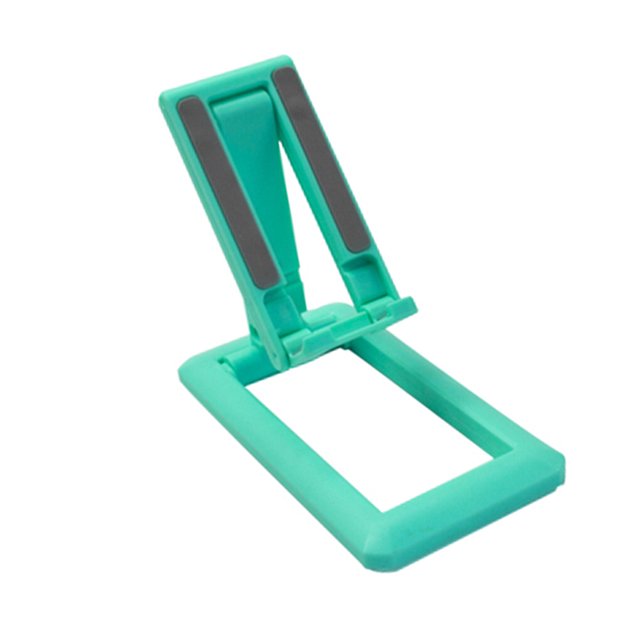ZLight Universal Mobile Phone Holder Stand Desktop Charging Base Double Adjustable Green 1Set. A compact and foldable phone and tablet holder in green, featuring double adjustable angles and anti-slip silicone cushions for stability. Made of durable PC and silicone materials, it measures 14.5 x 7 x 15 cm and is designed for ergonomic use, protecting the neck and cervical spine. Ideal for watching videos, reading, video recording, or browsing the web.