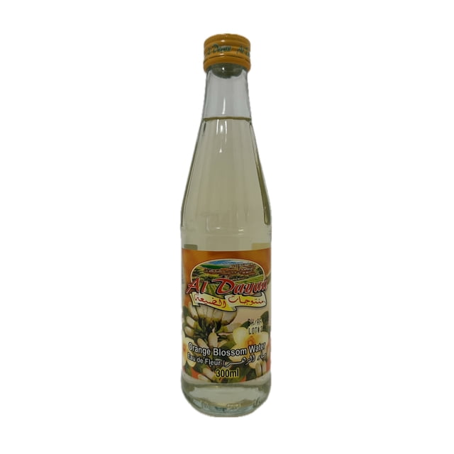 Al Dayaa Orange Blossom Water in a 300ml clear glass bottle with an orange screw cap, featuring a label with orange blossom flowers and bilingual Arabic and English text, ideal for enhancing sweets and warm beverages with delicate floral and citrus notes, also suitable as a gentle facial toner.