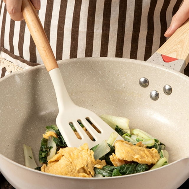 EGNMCR Kitchen Utensils Set, featuring a white silicone spatula with a wooden handle, shown in use stirring vegetables and eggs in a non-stick pan. The spatula is food-grade, BPA-free, and designed to protect non-stick cookware from scratches. It measures 32.3x8x2cm and is lightweight at 71g, making it suitable for various cooking scenarios, including frying and baking.