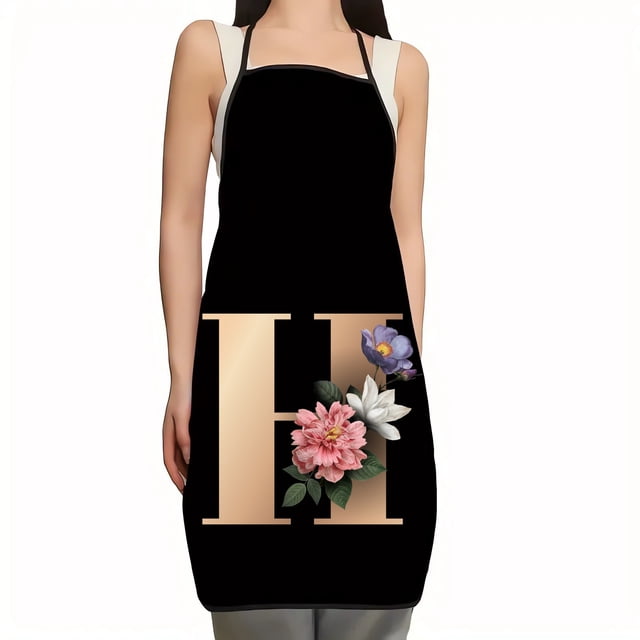 EGNMCR apron with a flower and letter pattern, designed for kitchen use. The apron features a black background with a bold beige letter 'H' decorated with pink, white, and purple flowers. Suitable as a stylish and functional kitchen linen or a thoughtful gift.