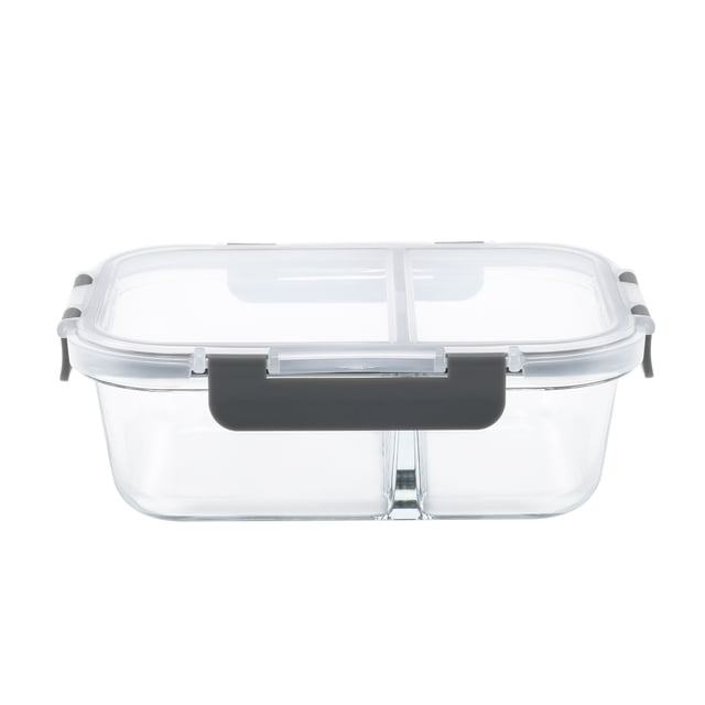 Mainstays Rectangle Glass Food Storage Container with Divider 980ML, clear borosilicate glass rectangular container with a transparent lid divided into two compartments and secured by four black locking clips, BPA-free and FDA approved, oven, microwave, freezer, and dishwasher safe, suitable for fresh food storage and meal prep.