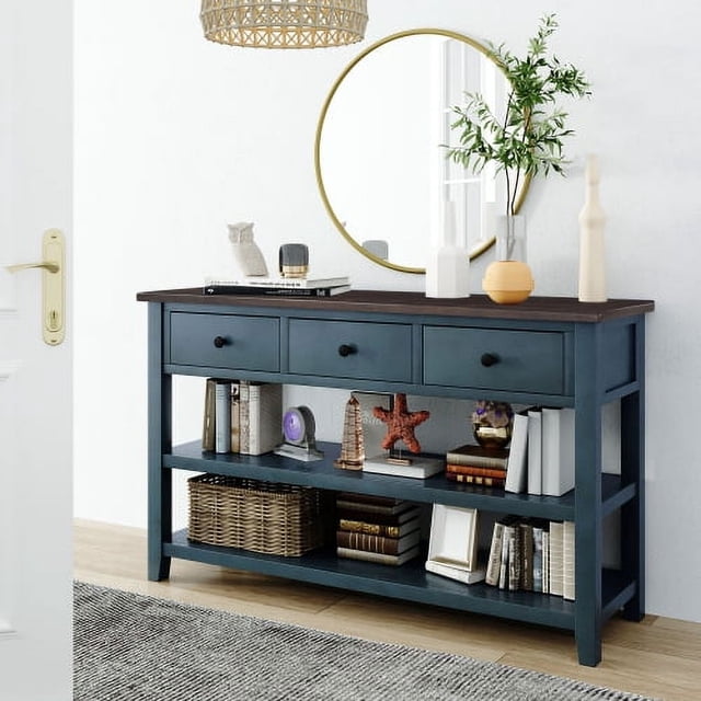 50-inch solid wood console table in antique blue with three storage drawers and two bottom shelves. The table is styled in a bright entryway with decorative items such as books, baskets, and ornaments. Made of high-quality wood and MDF, it features thickened legs for durability and a wear-resistant top. Suitable for use in hallways, living rooms, or offices.