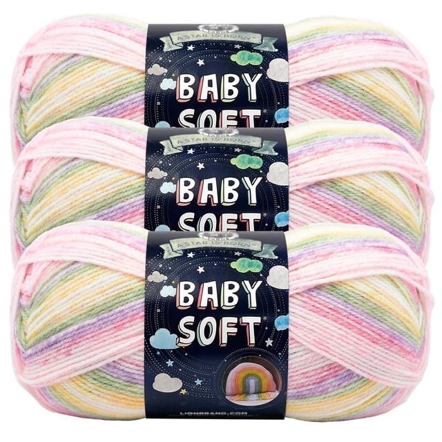 Lion Brand Baby Soft Yarn three skeins stacked, medium sportweight acrylic nylon blend in pastel rainbow colors with black labels featuring 'Baby Soft' text and star and cloud graphics, ideal for baby knitting and crafting projects with soft, durable yarn.