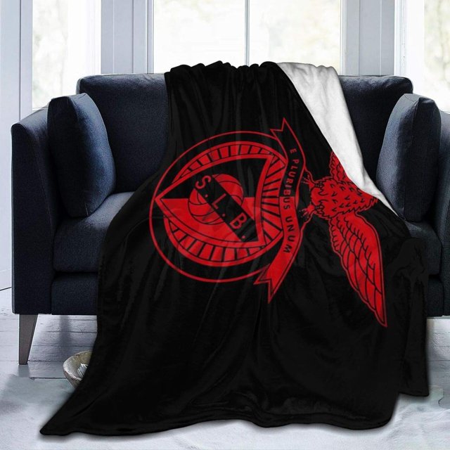 LAICAIW Benfica Ultra-Soft Lightweight Blanket Flannel Throw Blanket 80"X60" displayed draped over a dark blue sofa in a bright room. The blanket features a black base with a bold red Benfica logo, including an eagle and ribbon design. Made with 100% anti-pilling, high-quality fabric, it offers exquisite craftsmanship with overlock details. Suitable for children, adults, and grandparents, this lightweight and cozy blanket is ideal for adding warmth to bedding or as a stylish decor piece for living rooms or bedrooms.