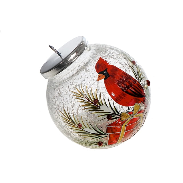 Led Crackled Glass Ornament Decor showing a red cardinal perched on a red gift box with gold ribbon, surrounded by green pine branches and red berries on a clear crackled glass sphere with a silver metal top and hanging hook, ideal for holiday tree or tabletop display.