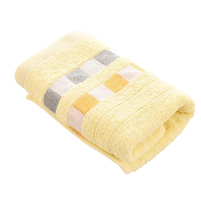 LAKUB Hand Towel on Clearance, a thickened cotton towel in a soft yellow shade with a checkered design in grey, white, and orange. Ideal for facial washing, it is super absorbent, breathable, and lightweight, measuring approximately 71 x 32 cm. Features include a durable double-stitched hem and machine washability for convenience.