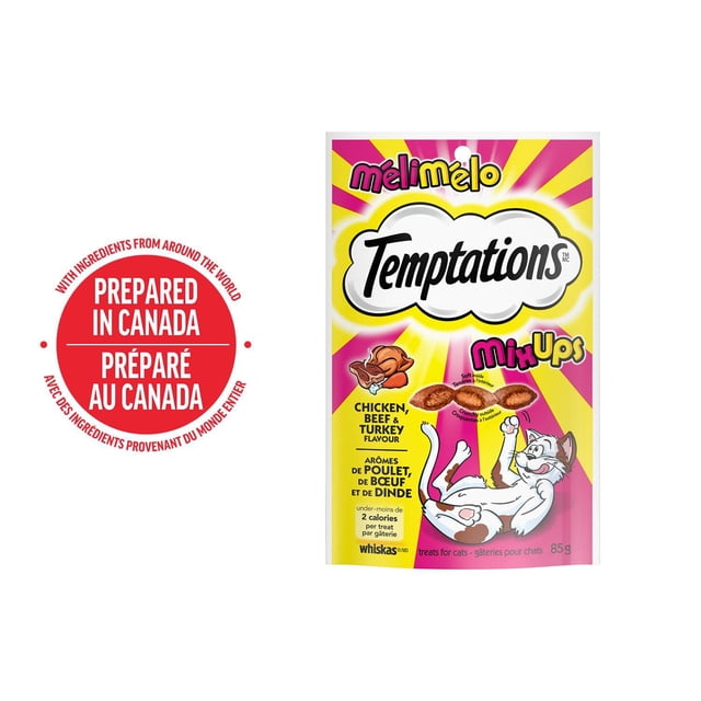 Temptations MixUps Chicken, Beef & Turkey Flavour Soft & Crunchy Cat Treats 85g pouch with bright yellow and pink rays background, featuring a playful cartoon cat and crunchy treats with soft filling, nutritionally complete and prepared in Canada.