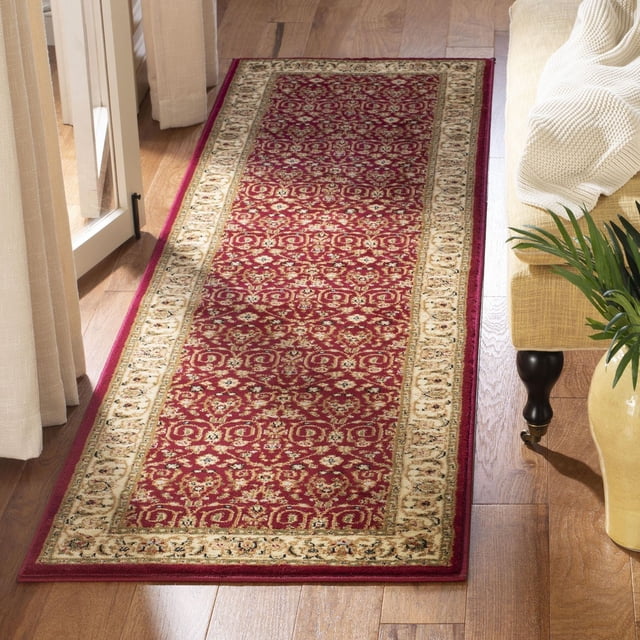 SAFAVIEH Lyndhurst Tapis Coureur Traditionnel à Perles Présentant un Champ central Rouge avec des Motifs Floraux Persans et de Vignes, Bordé d'Un Motif à Treillis beige, Posé sur un Plancher de Bois Franc à Côté d'Un sofa beige et d'Une Plante Verte, Idéal pour les Zones à Fort Achalandage.