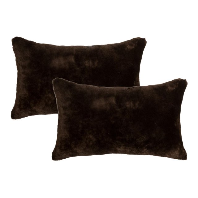 NELSON SHEEPSKIN PILLOW 12"X20" 2-PACK with two dark brown rectangular pillows made of 100% natural sheepskin featuring a thick 2.5-inch pile, hidden zipper closure, and soft microsuede backing, ideal for adding texture and warmth to home décor and suitable for layering with other throw pillows.