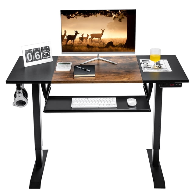 Costway 48" Electric Sit to Stand Desk Adjustable Workstation with a rustic brown engineered wood desktop and black steel frame. This ergonomic desk features a slide-out keyboard tray, spacious 48" x 24" surface, headphone hooks, and programmable remote control with three memory presets. The adjustable workstation transitions smoothly from 27" to 46.5" in height and includes anti-collision technology for safety. Ideal for home or office use.