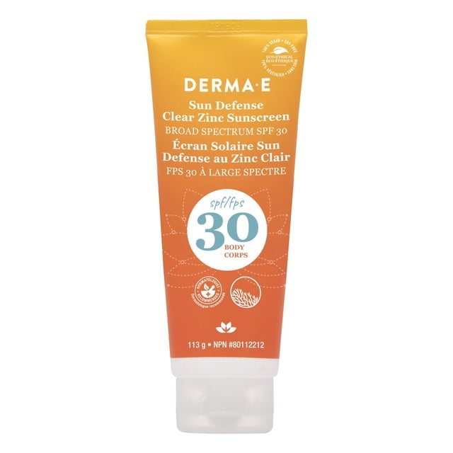 Sun Defense Clear Zinc Sunscreen SPF 30 Body by DERMA E in an orange gradient squeeze tube with white flip cap, providing broad spectrum UVA/UVB protection with mineral clear zinc oxide, reef-safe and dermatologist recommended, containing 113 g for body use.