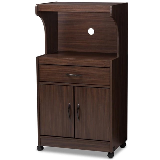 Baxton Studio Tannis Support de Micro-Ondes en Brun Noyer Foncé avec un Cadre Moderne en Bois d'Ingénierie à Fini Noyer Foncé. le Support Comprend un Compartiment Spacieux pour Micro-Ondes avec une Découpe au Panneau Arrière pour la Gestion des Fils, un Tiroir avec Poignées Noires et Deux Tablettes derrière des Portes Discrètes pour un Rangement Supplémentaire. l'Unité Est Équipée de Roulettes pour la Mobilité et Mesure 45,2 Pouces de Hauteur, 24,02 Pouces de Largeur et 15,75 Pouces de Profondeur. Assemblage Requis.