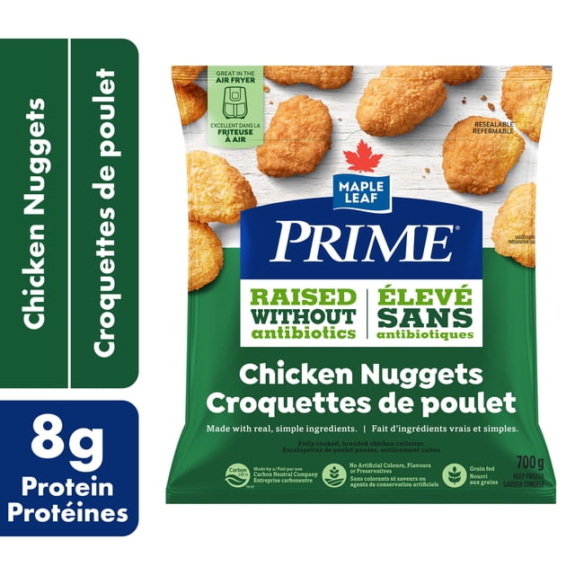 Prime Breaded Chicken Nuggets in a resealable green and white bag with Maple Leaf Prime branding, highlighting chicken raised without antibiotics, 8g protein per serving, no artificial colours or preservatives, grain-fed chicken, and carbon-neutral production, 700g net weight.