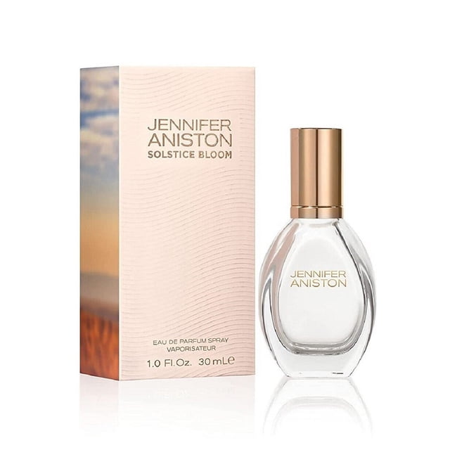 Jennifer Aniston Solstice Bloom Eau de Parfum Spray, Perfume for Women, 10 oz. A clear glass bottle with a gold-tone cap, complemented by a pastel ombre box with branding. This luxurious fragrance blends gardenia, jasmine, white musk, golden sand accord, and warm woods, ideal for day-to-night wear.