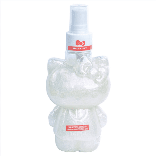 Girls Hello Kitty Vanilla Scented Body Glitter Spray in a 6oz clear plastic bottle shaped like Hello Kitty with a white spray nozzle and red label, containing shimmering vanilla-scented glitter body mist suitable for playtime and parties.