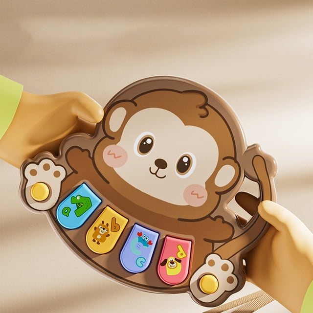 IROINID Education Toys, a coffee-colored infant electronic organ shaped like a monkey with colorful animal-themed buttons. This music box toy is designed for early education, enhancing auditory, hand-eye coordination, and intellectual skills. Compact and portable, ideal for children to explore music and develop finger flexibility.