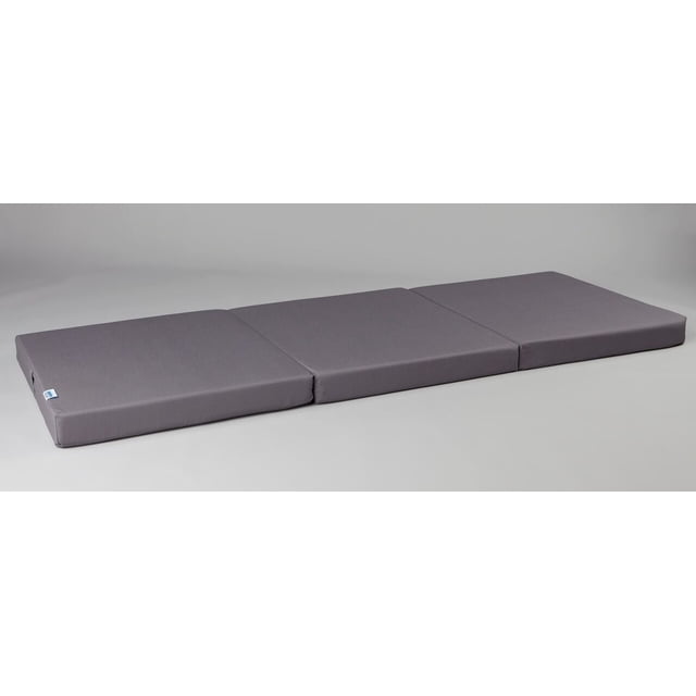 Orthowave™ Fold-Away Bed - Standard Grey unfolded flat on a neutral background, featuring three connected foam mattress panels with a smooth grey polyester/cotton cover and a brand tag, designed for easy folding and compact storage in small living spaces, ideal for extra sleeping accommodations.