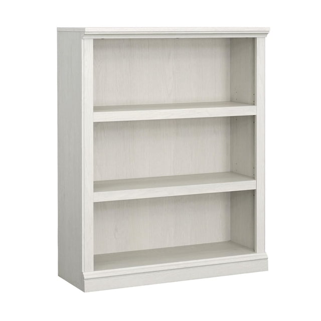 Sauder Select 3-Shelf Bookcase in a light wood finish, featuring three spacious shelves, two of which are adjustable for flexible storage. Designed for multi-room use, this functional bookcase is suitable for living rooms, offices, kitchens, or craft rooms. Includes a wall anchor kit for safety and clear assembly instructions.