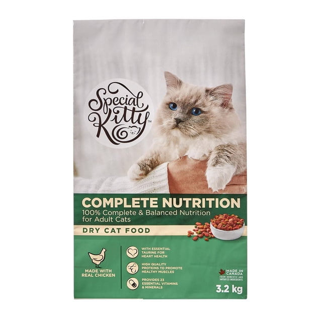 Special Kitty Complete Nutrition Dry Cat Food 3.2 kg bag featuring a fluffy cat with blue eyes held by a person wearing a white sweater. The packaging highlights 100% complete and balanced nutrition for adult cats, made with real chicken, taurine for heart health, high-quality proteins for muscle support, and 23 essential vitamins and minerals. Made in Canada from domestic and imported ingredients.