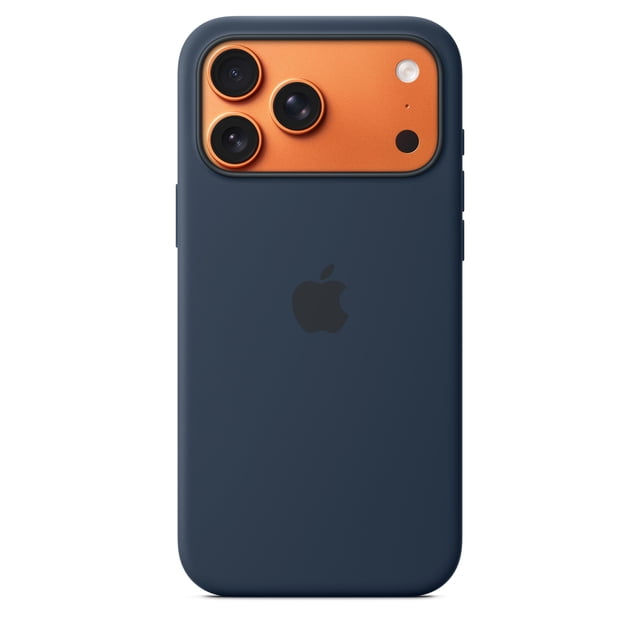 iPhone 17 Pro Max Silicone Case with Magsafe Midnight shown from the back, featuring a midnight blue recycled silicone exterior with a soft-touch finish, fitted around the orange triple-lens camera module, with built-in magnets for MagSafe and a centered black Apple logo.