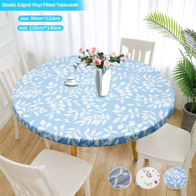 Ihvewuo Elastic Edged Vinyl Fitted Tablecloth with flannel backing and elastic edge, shown in a blue leaf pattern. This round table protector fits tables with diameters of 90 cm to 110 cm or 110 cm to 140 cm. Waterproof, oil-proof, and wipeable design suitable for indoor and outdoor use, displayed on a wooden table surrounded by white chairs in a bright dining area.