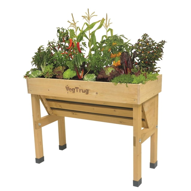 VegTrug Small Wall Hugger Raised Garden Bed Planter made from 100% FSC sustainable cedar wood with plastic feet, designed with a deeper back for large plants and shallower front for herbs, elevated at 32 inches for easy gardening on patios or balconies, includes a fabric liner for soil containment and drainage.