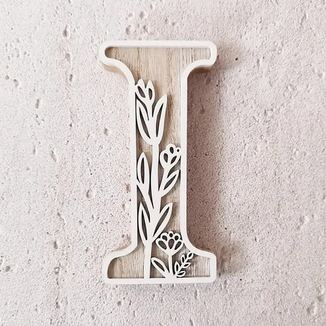 5 Inch Wooden Letters for Wall Decoration featuring the letter 'I' with a floral cutout design. Made from durable wood, the letter has a natural wood grain background and white painted edges. Ideal for crafting, name signs, weddings, and home decor. Lightweight and easy to mount, suitable for customization with paint or other decorations.