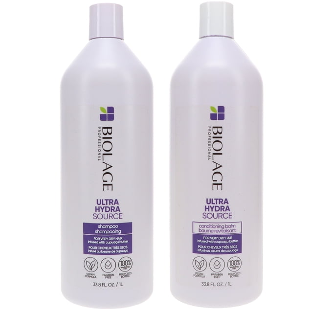 Matrix Biolage Ultra Hydrasource Shampoo 33.8 oz and Ultra Hydrasource Conditioner 33.8 oz combo pack. Two large bottles with a sleek design, featuring the Biolage logo and product details. The shampoo and conditioner are formulated to gently cleanse, moisturize, and strengthen dry, damaged hair. Paraben-free and enriched with aloe leaf juice, apricot kernel, and cupuacu butter for balanced hydration and frizz control. Ideal for restoring manageability and softness to coarse tresses.
