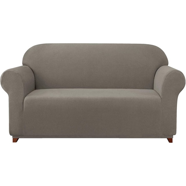 Subrtex Housse de Canapé Extensible 1 Pce Slipcover Antidérapante avec Motif à Carreaux Texturé dans un Ton Neutre. la Slipcover Est Conçue pour s'Adapter Parfaitement avec des Coins Élastiques Intégrés, Offrant un Ajustement Semi-Personnalisé pour les sofas. Fabriquée à Partir de 85 % polyester et 15 % Élasthanne, Elle Est Douce, Respirante et durable. Convient pour Protéger les Meubles contre les Déversements, les Taches et l'Usure, Idéale pour les Maisons avec des Enfants Ou des Animaux de Compagnie. Présentée sur un Sofa standard dans un Cadre Uni.