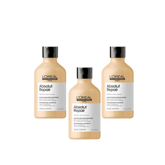 Loreal Professionnel Paris Serie Expert Absolut Repair Shampoo 300 ml 3 Pack. This restorative shampoo is designed for damaged and dry hair, enriched with golden quinoa dandruff extract and wheat protein to enhance resilience, softness, and shine. The image shows three beige bottles with black caps, each labeled with the product name and details.