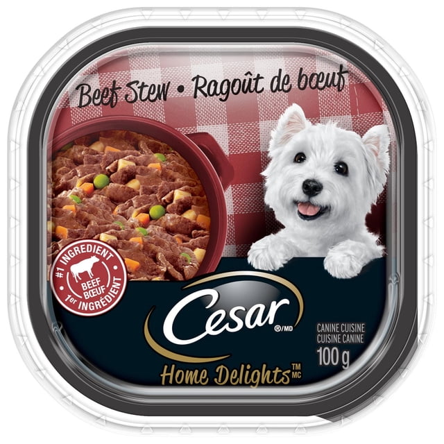 Cesar Home Delights Ragoût de Bœuf Doux et Humide pour Chien Contenant de 100 g Présentant des Morceaux de Bœuf Cuits Lentement avec des Pois et des Carottes en Sauce sur un Fond à Carreaux Rouges, Marqué du logo Cesar et Mettant en Valeur le Bœuf comme Ingrédient Numéro un, Idéal pour une digestion Facile.