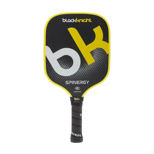 Black Knight Spinergy pickleball paddle with classic shape, black 3k woven carbon face featuring large yellow and white 'bk' logo, yellow edge guard, and black wrapped grip handle, midweight with polymer honeycomb core for enhanced playability and forgiveness, ideal for all skill levels.