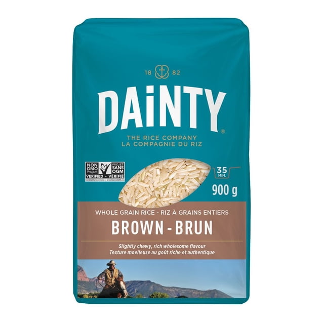 Dainty Brown Long Grain Rice 900 g package with teal and brown design, featuring a clear window displaying natural whole grain brown rice, labeled gluten free and non-GMO, with 35-minute cooking time and noted for its slightly chewy texture and rich wholesome flavour, ideal for nutritious meals.