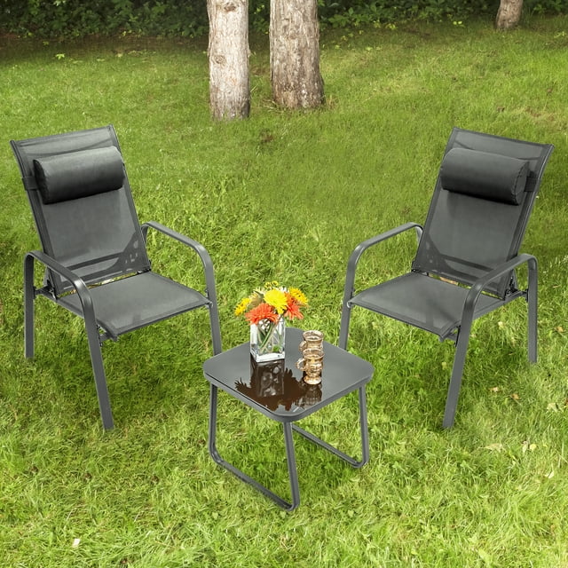Costway 3PCS Patio Bistro Furniture Set Adjustable Back Stackable Chairs Grey. This outdoor set includes two grey chairs with adjustable backrests and headrests, and a square coffee table with a tempered glass top. The chairs feature breathable, quick-drying fabric and ergonomic armrests, while the table has anti-slip foot pads for stability on uneven surfaces. The set is displayed on a grassy outdoor area with trees in the background, showcasing its suitability for patios, porches, or balconies.