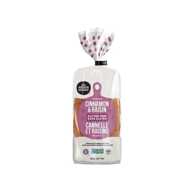 Little Northern Bakehouse Gluten Free Cinnamon Raisin Bread in a clear plastic bag with purple polka dot twist tie, featuring a purple cutting board-shaped bilingual label, 482 g loaf of non-GMO, 100% plant-based gluten-free bread with visible raisins, ideal for frozen bakery use.