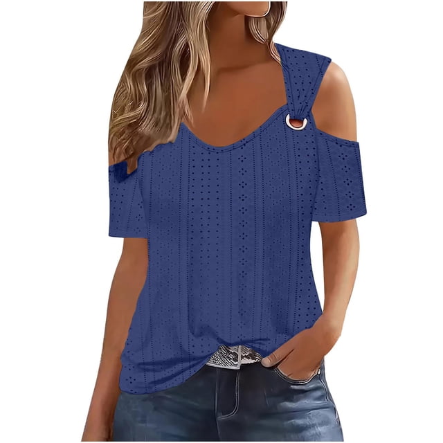 Timegard Women's Plus Size Tops Eyelet V-Neck Short Sleeve Cold Shoulder Summer Dressy Casual Tunic Tops in a deep blue color. The top features an eyelet pattern, a V-neckline, and cold shoulder design with a decorative ring detail on the strap. Made from breathable fabric, it is suitable for summer, spring, and fall. Styled with jeans for a casual look.