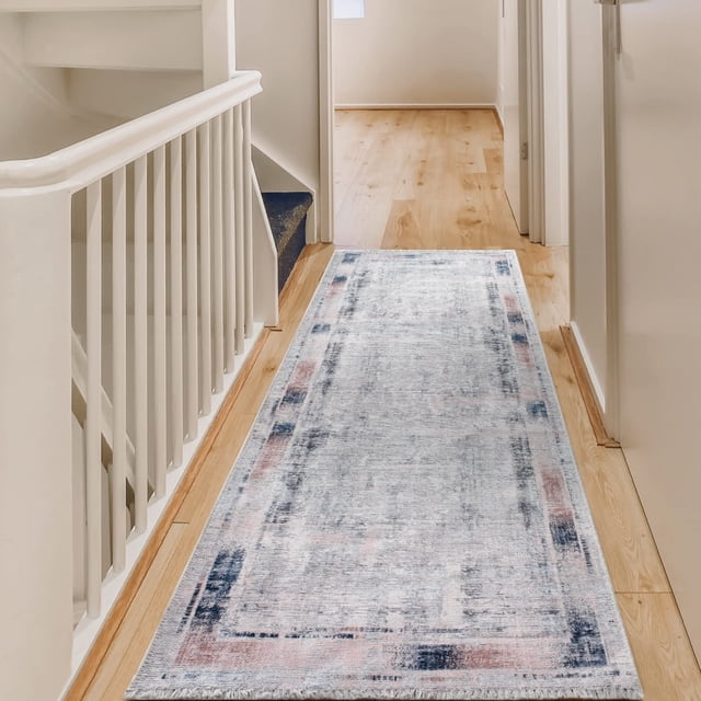 BY COCOON 2'6"x8' runner rug displayed in a hallway with light wood flooring and white walls. The washable rug features a low pile thickness of 0.2 inches, a subtle multicolour pattern with soft tones, and a non-slip backing for added safety. Made in Turkey with durable cotton and chenille materials, it is resistant to stains, fading, and shedding, making it ideal for high-traffic areas like entryways, kitchens, and hallways. The rug is easy to clean and safe for homes with kids and pets.
