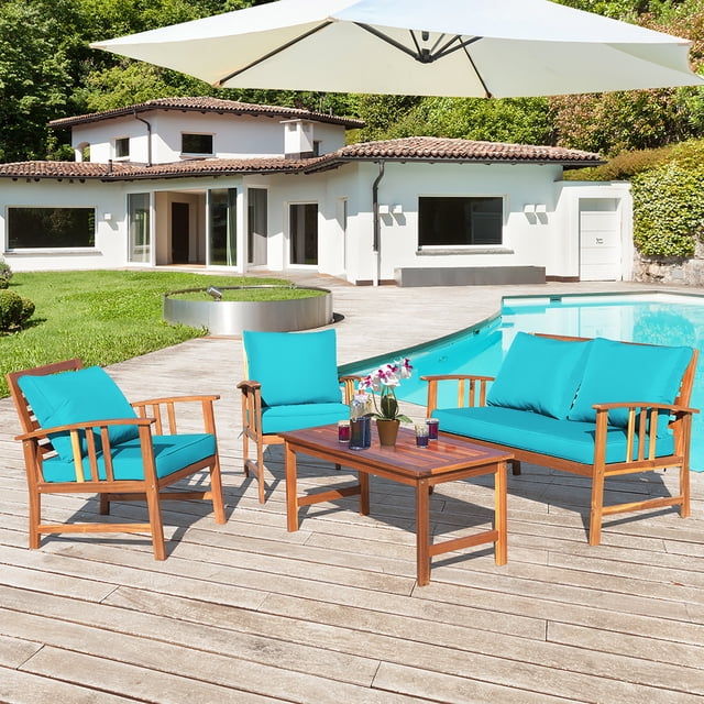 Costway Ensemble de Mobilier de Patio en Bois 4 Pcs avec un Cadre en Bois d'Acacia et des Coussins turquoise, Idéal pour les Conversations sur le Patio Extérieur. Comprend un Causeuse, Deux Chaises Simples et une table Rectangulaire, Disposés sur une Terrasse en Bois Près d'Un Bord de Piscine. Comprend des Coussins Épais avec des Housses Amovibles pour le Confort et un Entretien Facile.