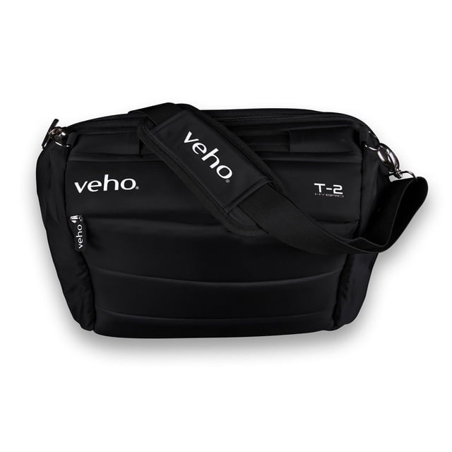 Veho T-2 Super Padded Hybrid Laptop/Notebook Bag with Rucksack Option in black, front view showing padded exterior, adjustable shoulder strap with Veho branding, zipped compartments, and sleeve for carry-on flight bag handles, designed to protect laptops up to 17 inches and tablets up to 10 inches, also suitable for storing business accessories.