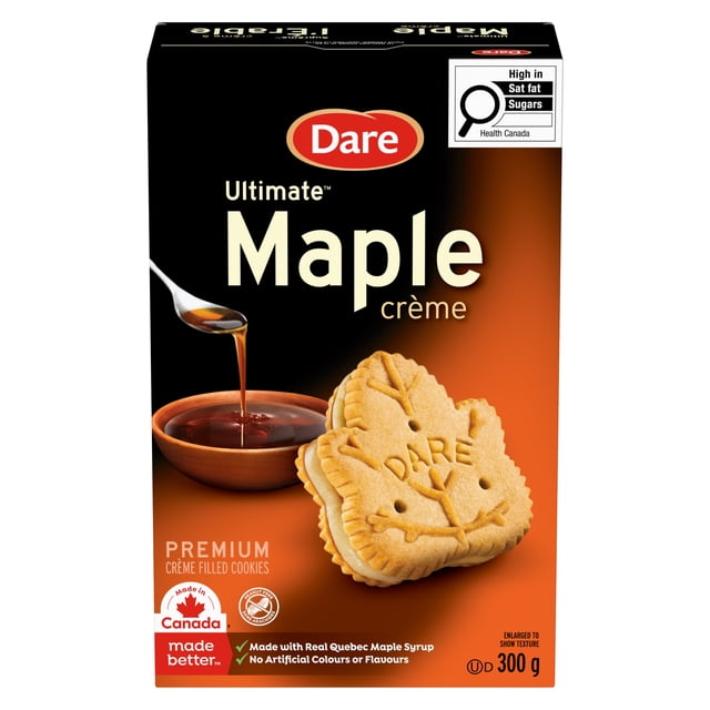Dare Suprême Boîte de Biscuits à la Crème d'Érable Montrant des Biscuits Fourrés à la Crème en Forme de Feuille d'Érable Faits avec du Vrai Sirop d'Érable du Québec, Sans Colorants Ni Arômes Artificiels, Emballage de 300 g avec Étiquette de Santé Canada pour les Gras Saturés et les Sucres.