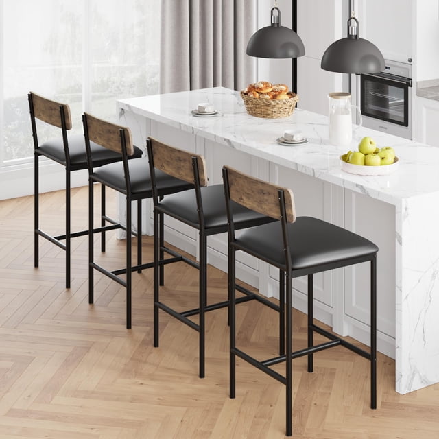 AKDSteel Bar Stools Set of 4, upholstered counter height stools with ergonomic backrests and footrests. Crafted with a rustic brown MDF seat and durable black metal frame, these stools are positioned at a white kitchen island with a marble countertop. Perfect for bar seating or kitchen furniture in modern dining spaces.