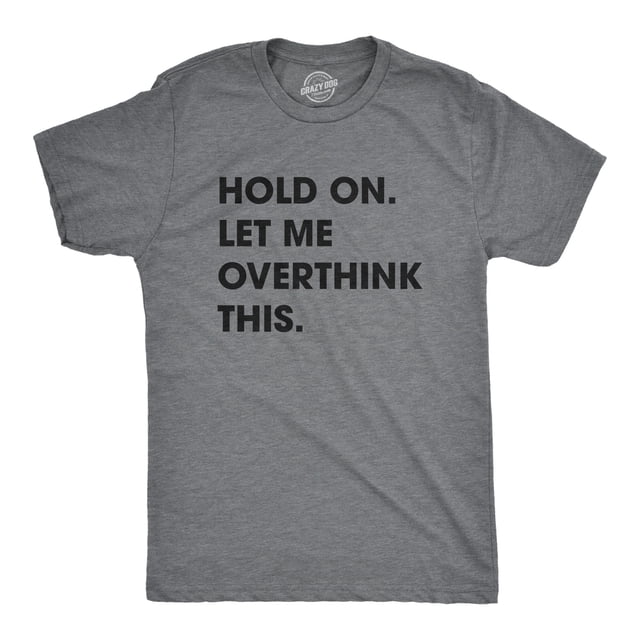 Mens Hold On Let Me Overthink This T shirt Funny Sarcastic Hilarious Adult Tee in dark heather grey, size M. The shirt features bold black text reading 'HOLD ON. LET ME OVERTHINK THIS.' centered on the front. Made from soft cotton with a slim fit, it is machine washable and designed by Crazy Dog T-Shirts.