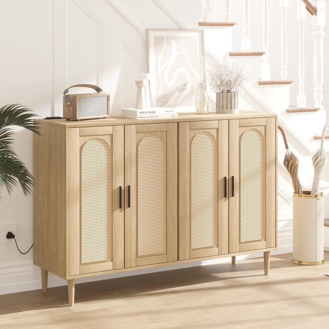 Buffet Cabinet with Charging Station, 47.4-inch farmhouse sideboard featuring four rattan doors and adjustable shelves. The cabinet is crafted from engineered wood with a natural finish and black hardware, blending rustic and modern styles. It includes a built-in USB charging station for added convenience. Displayed in a bright hallway setting, the cabinet is styled with decorative items on top, showcasing its versatility for use in kitchens, living rooms, or hallways.
